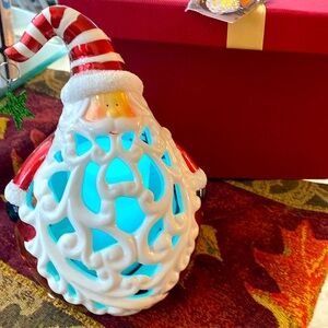 Santa Claus with candle inside